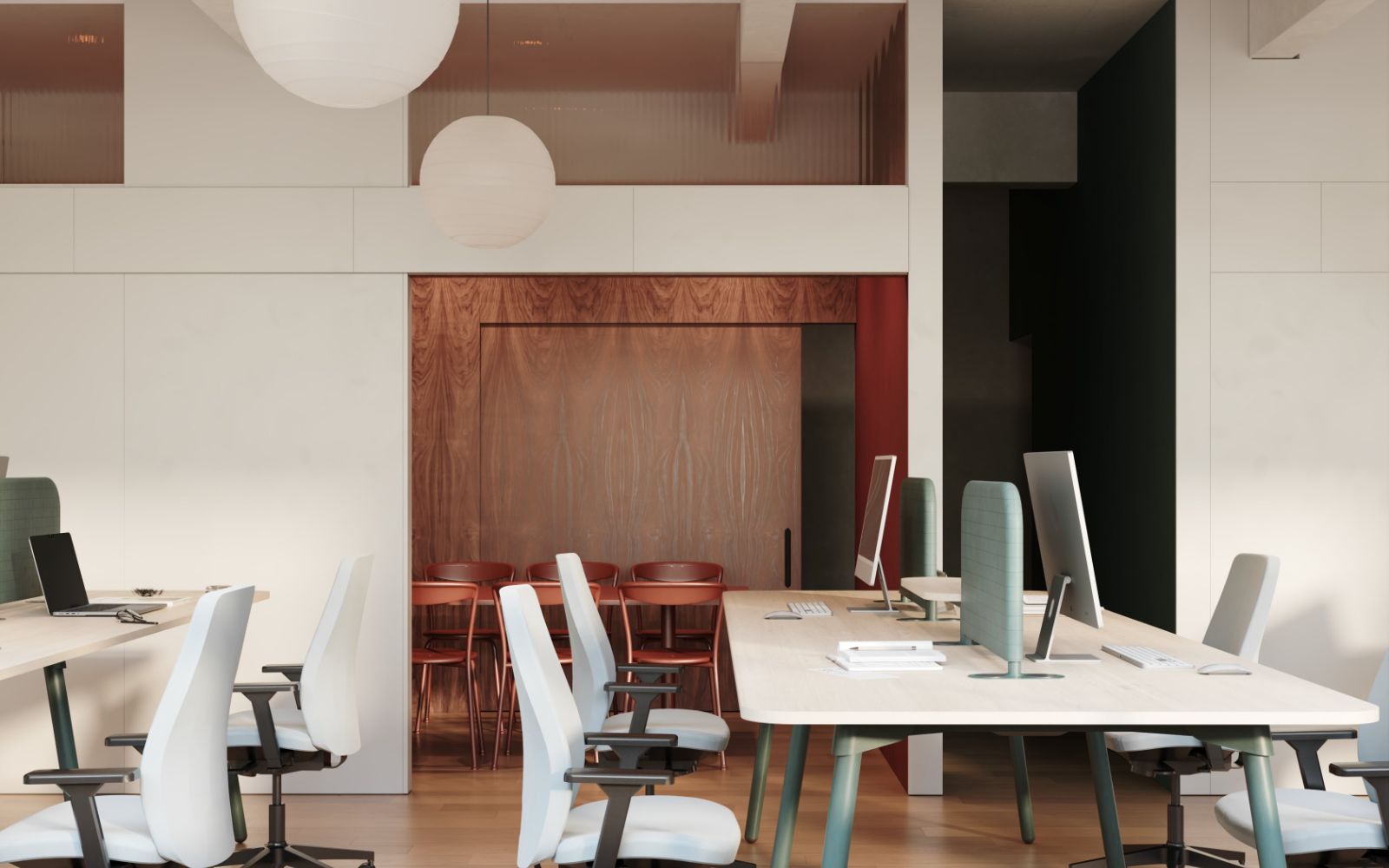 An office floor with desking and a glazed meeting room